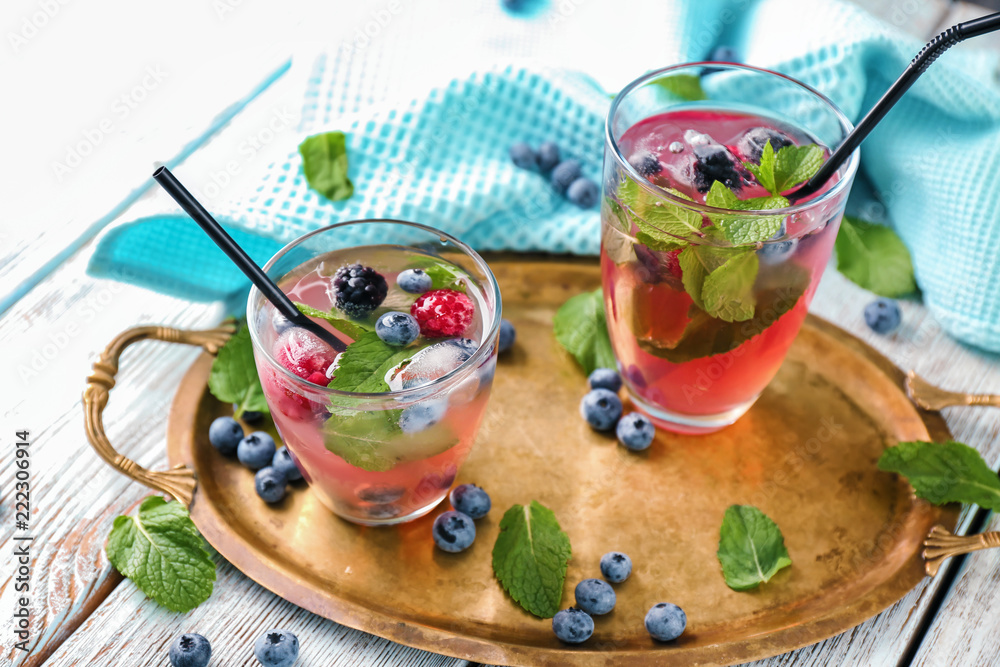 Glasses of refreshing summer cocktail on table