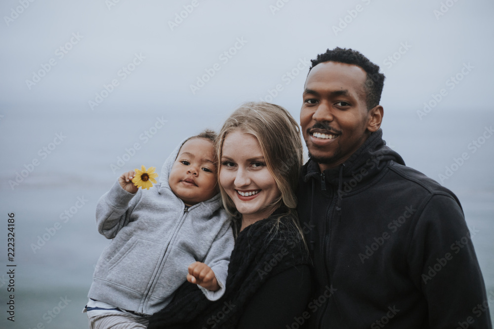 Happy family by the water