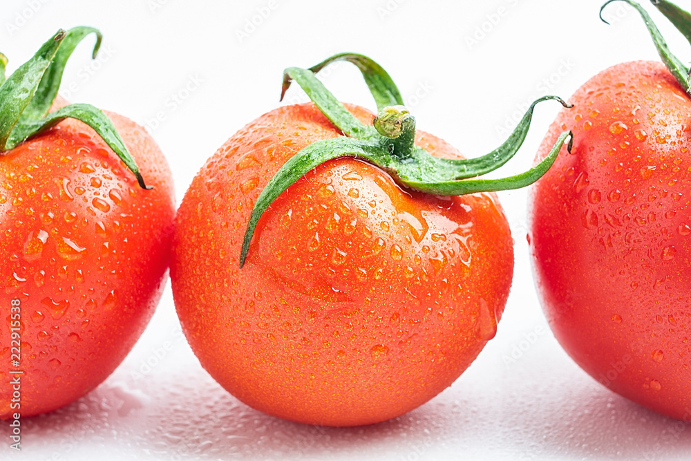 Fresh tomatoes on white background