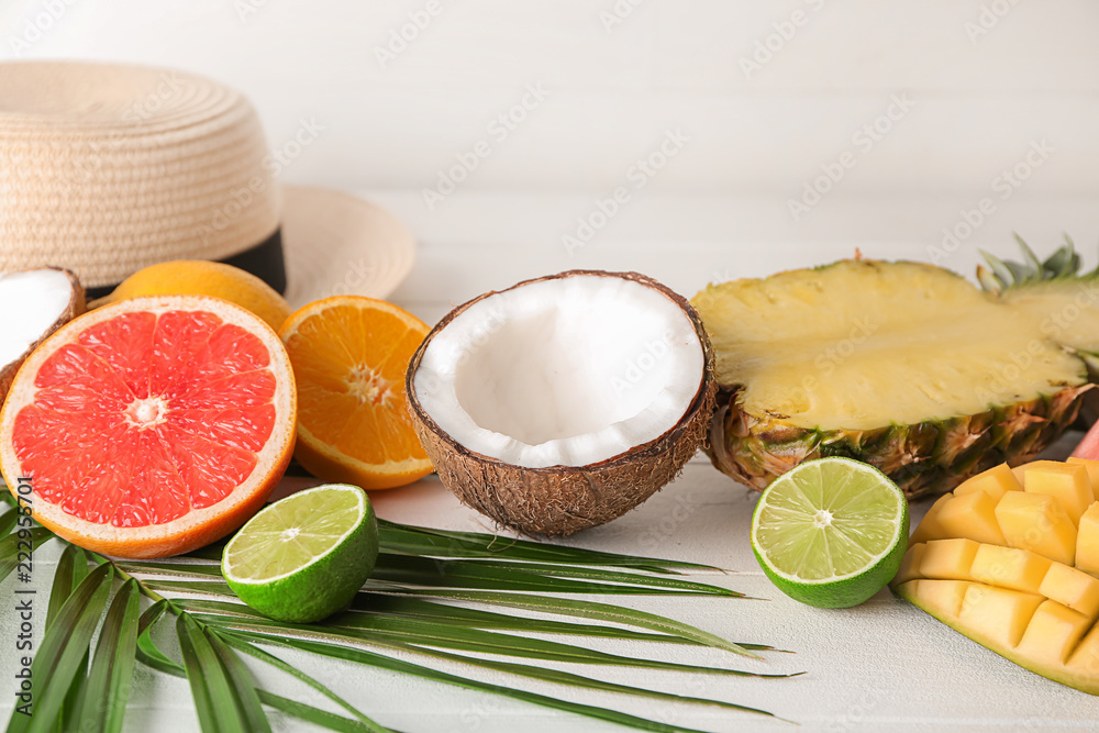 Various delicious exotic fruits with hat on light table