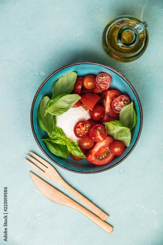 Caprese salad on blue background