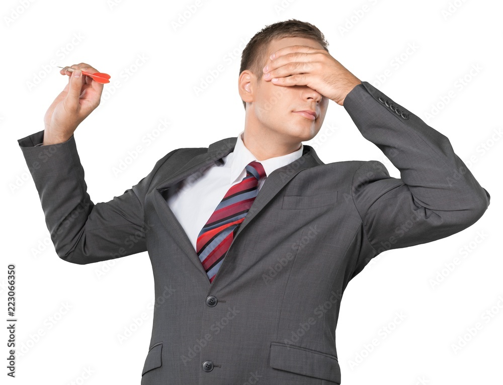 Portrait of a Businessman Throwing Dart with Hand over Eyes