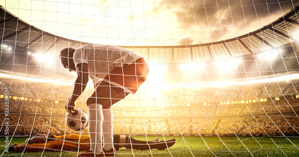 Intense soccer moment in front of the goal on the professional soccer stadium.