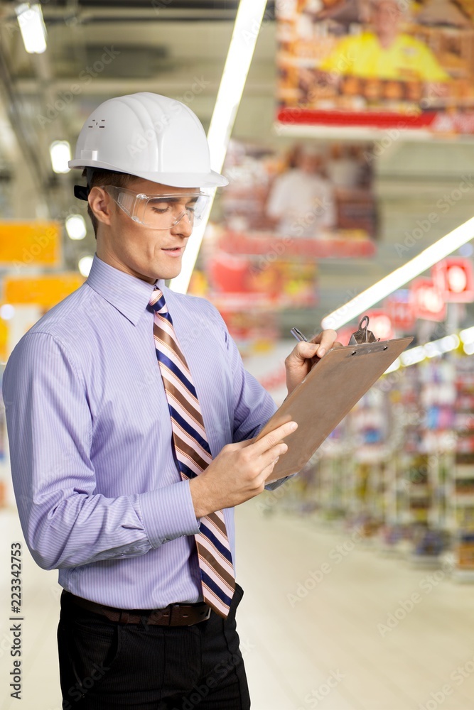 Young handsome man working in mall