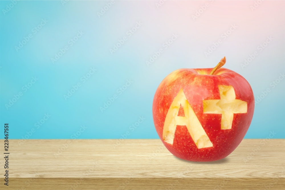 Fresh red apple  with a + isolated