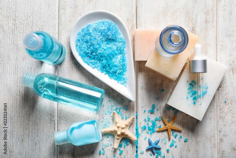 Composition with bath products on light wooden table