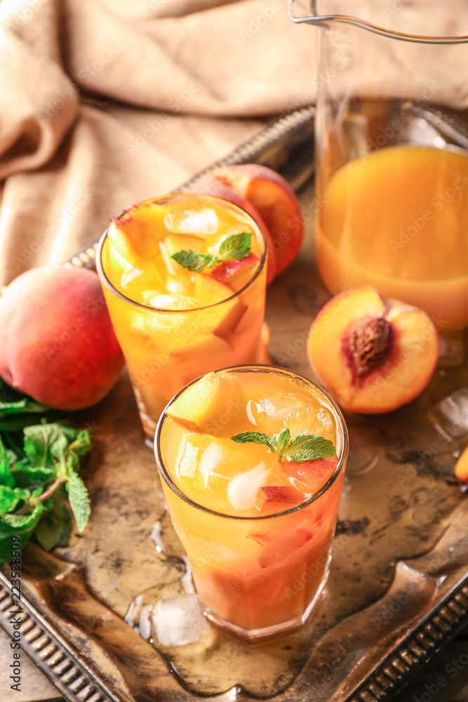 Fresh summer cocktail in glassware on metal tray