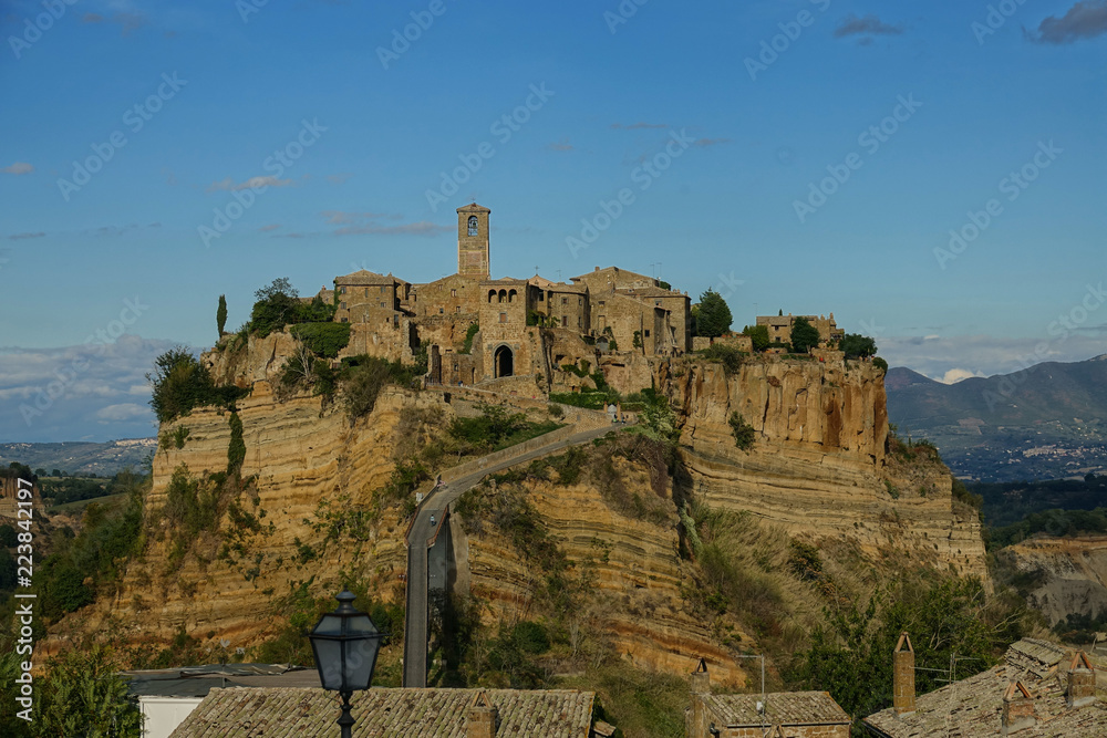 AERIAL: Beautiful shot of ancient Civita di Bagnoregio built on a mountain.