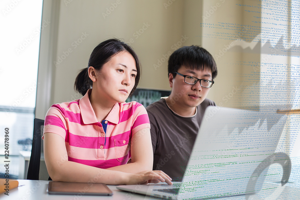 yang man and women working with computer