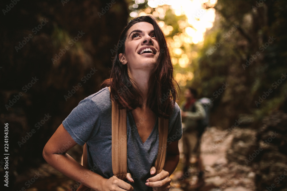 Beautiful woman enjoying hiking in nature