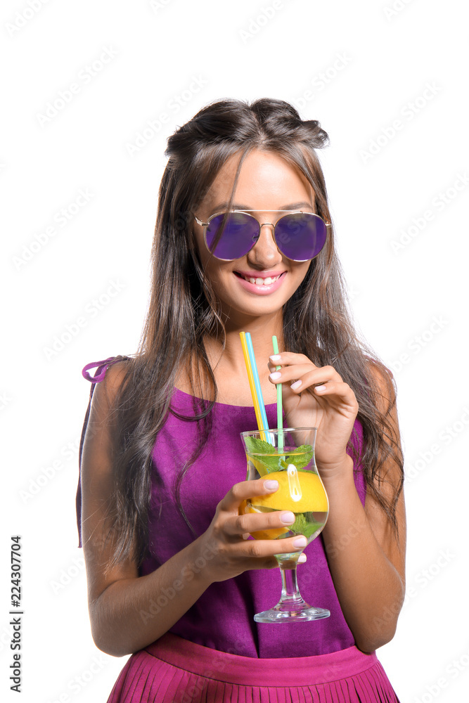 Young woman with glass of fresh lemonade on white background