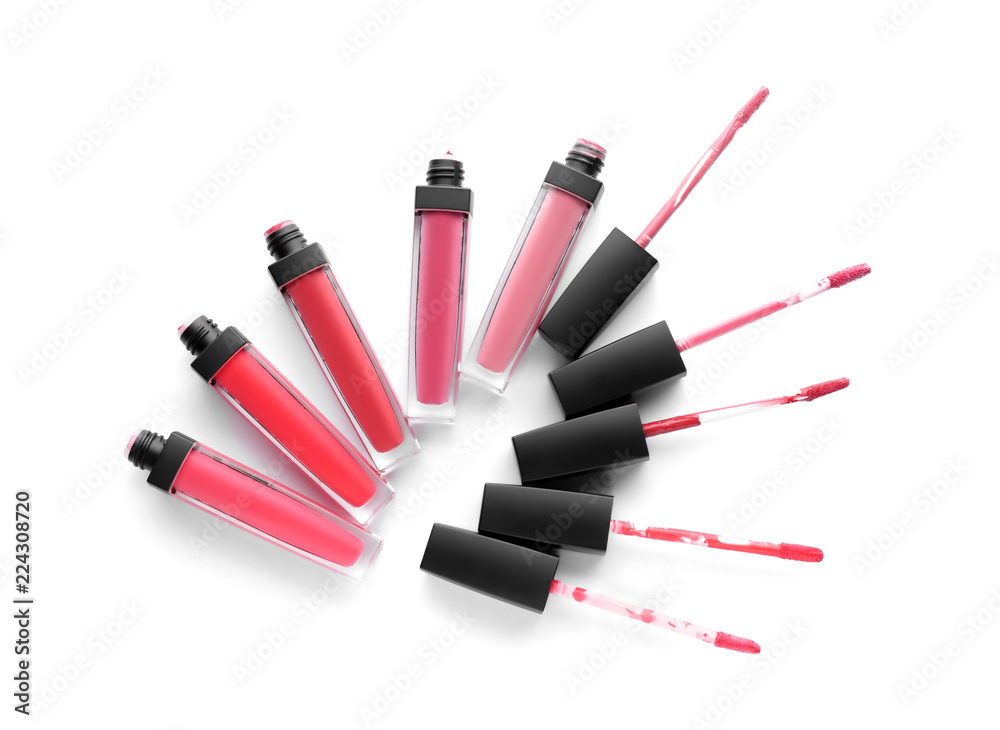 Liquid pink lipsticks on white background