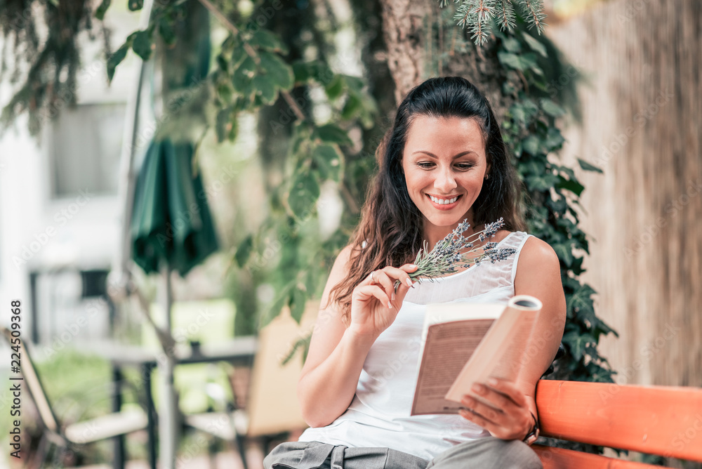 Enjoy reading a book outdoors in the city.