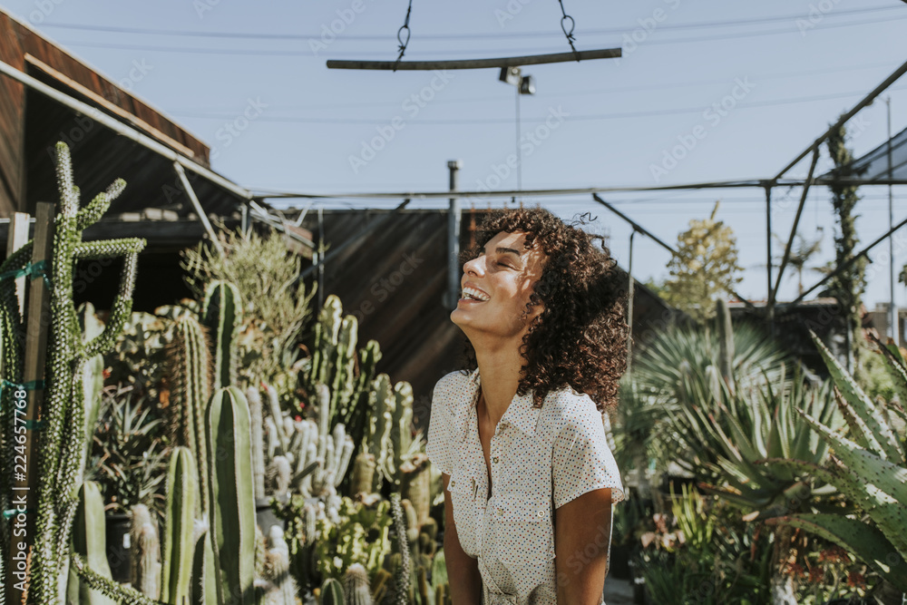 Beautiful woman at a cactus garden