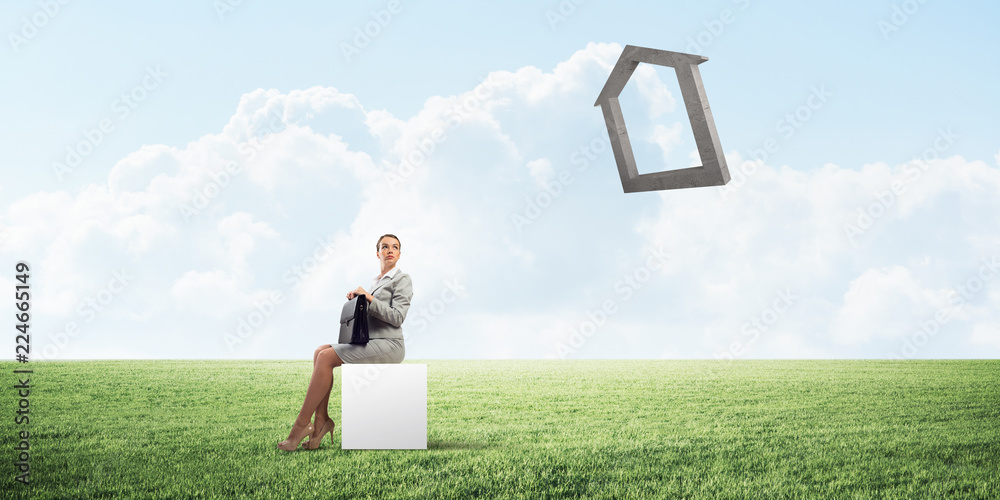 Attractive business lady or accountant outdoors on white box