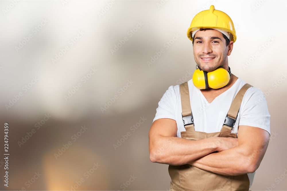 Portrait of happy young foreman with hard