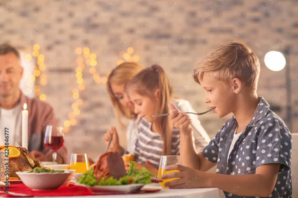 Happy family having Christmas dinner at home