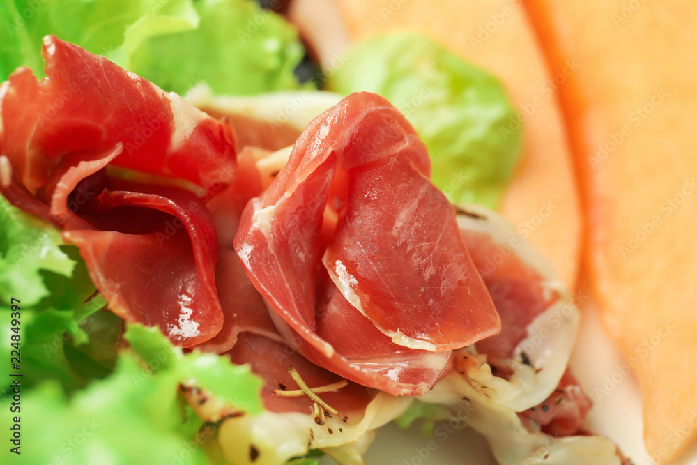 Delicious melon with prosciutto, closeup