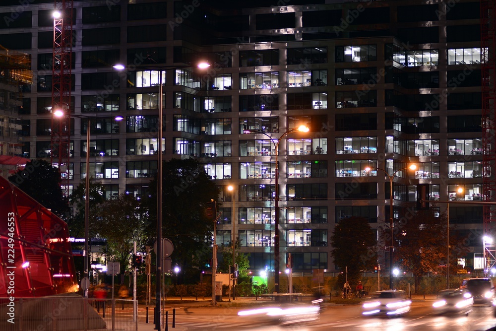 Modern office building at night.