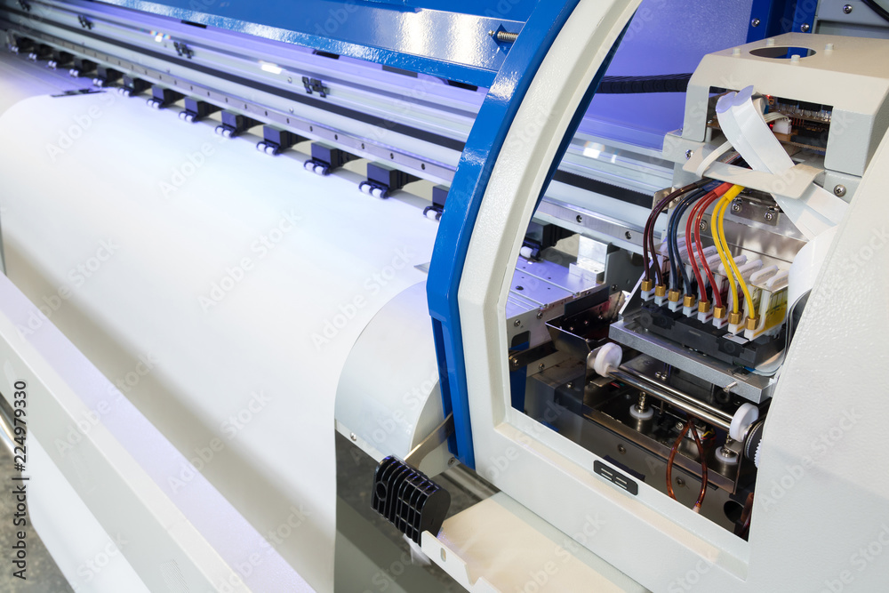 Blank paper roll and ink circuits in large printer format inkjet machine for industrial business.