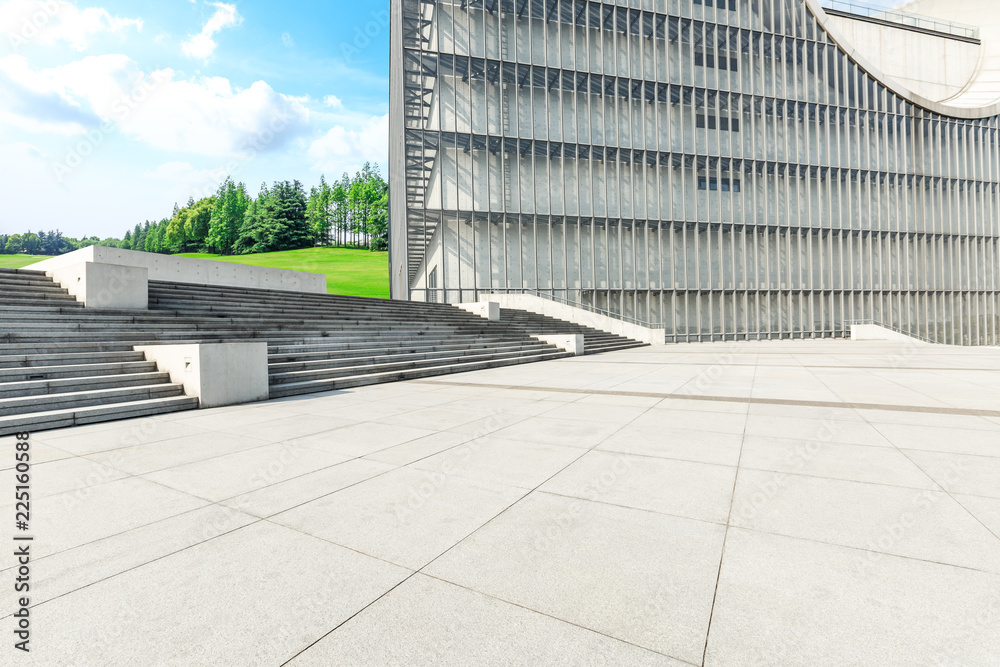 Empty square floor and green forest natural scenery in the city park