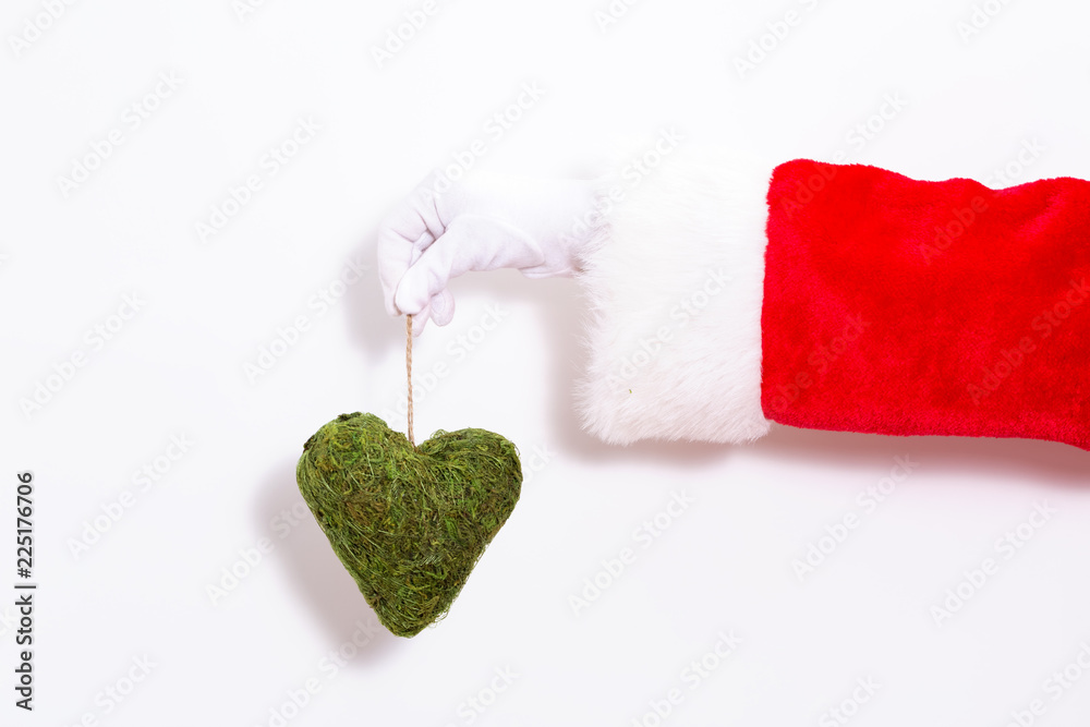 Santa claus holding a herat ornament on a white background