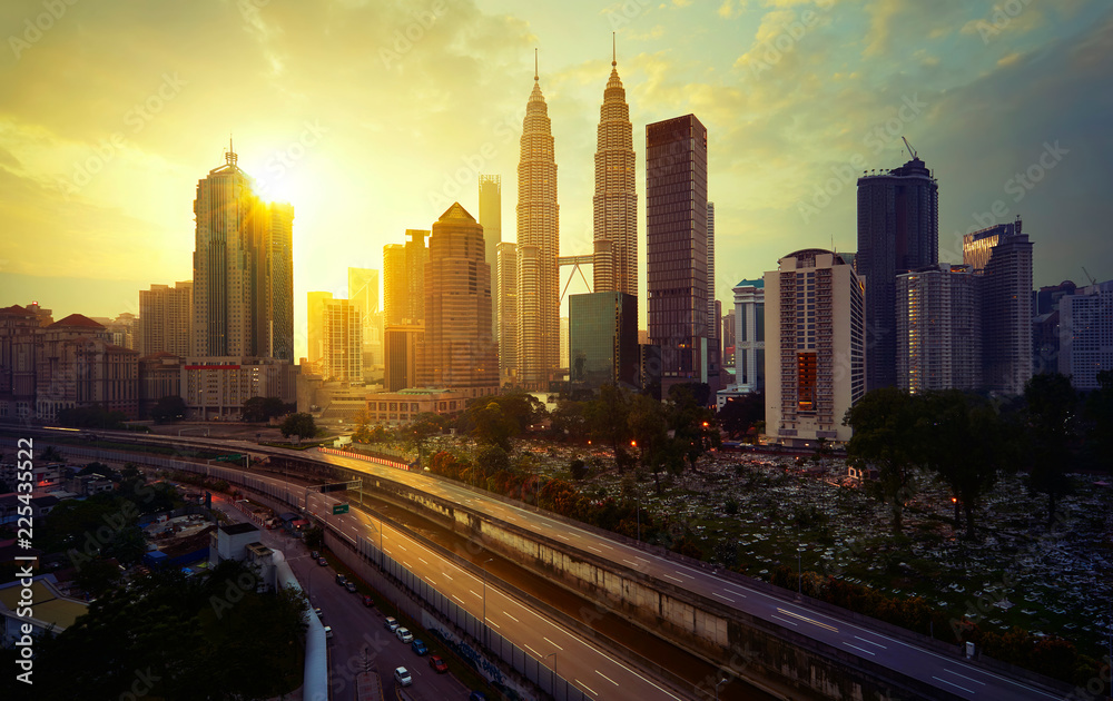 Sunrise in Kuala Lumpur with the silhouette of the Kuala Lumpur city skyline