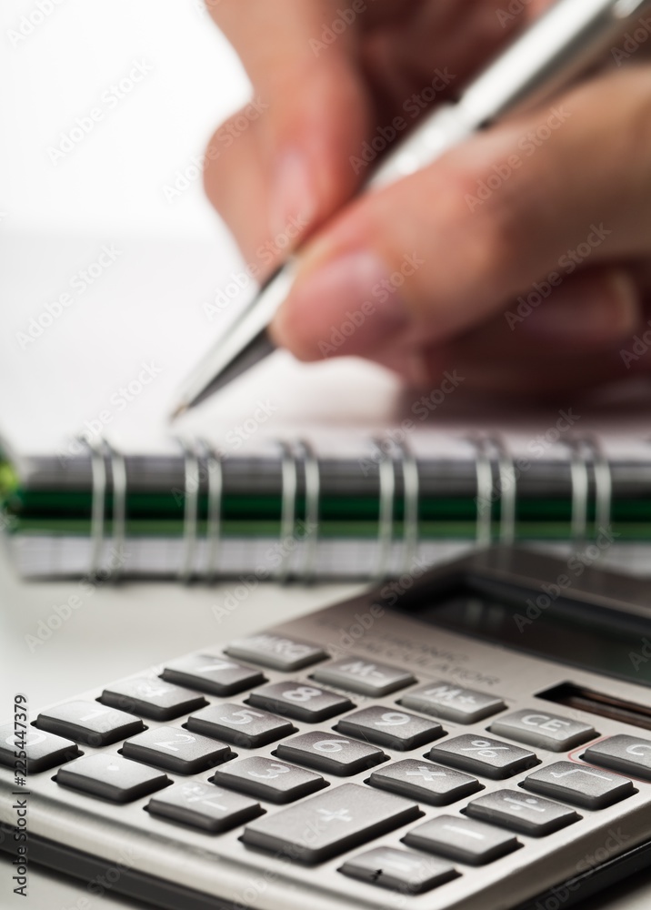 Woman Writing on Notepad