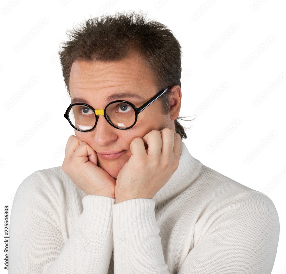 Portrait of young businessman with glasses in white sweater with