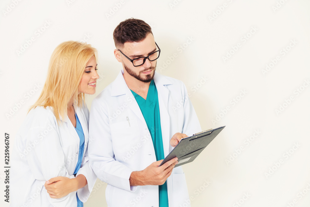 Doctors looking and discussing on documents paper.