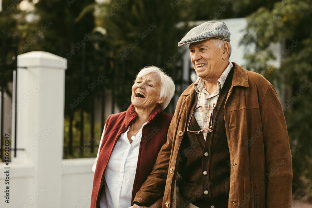 Senior couple walking outdoors on a winter day