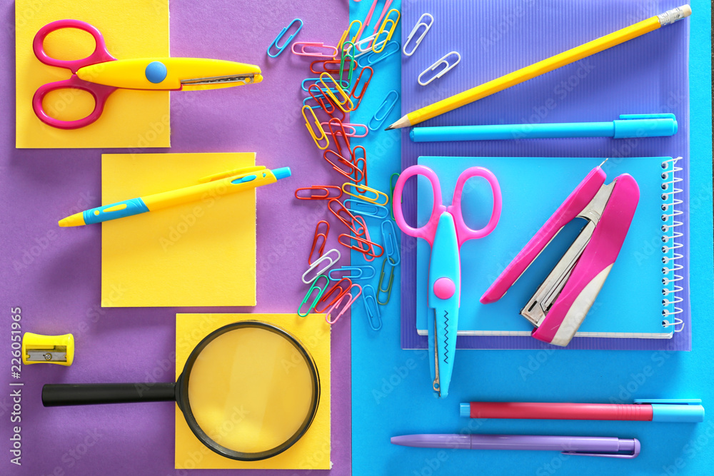 Set of school stationery on color background