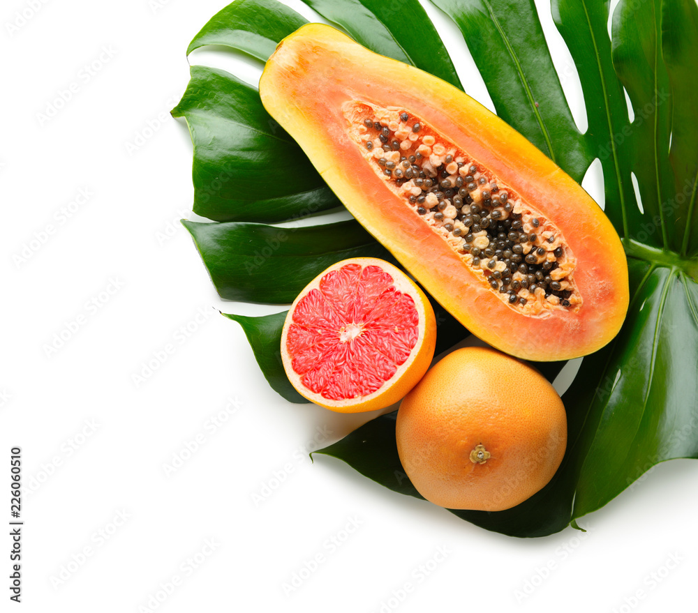 Summer composition with tropical fruits on white background