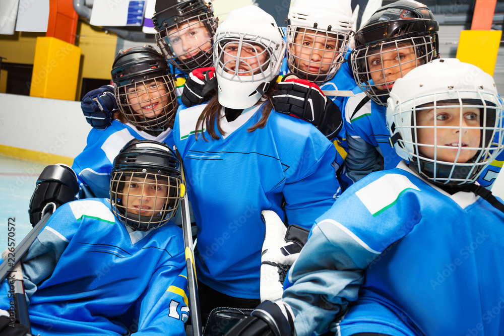 Happy ice hockey team with goaltender after game