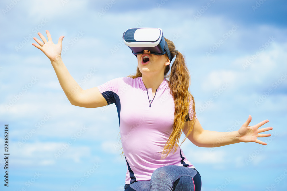 Woman wearing VR outside