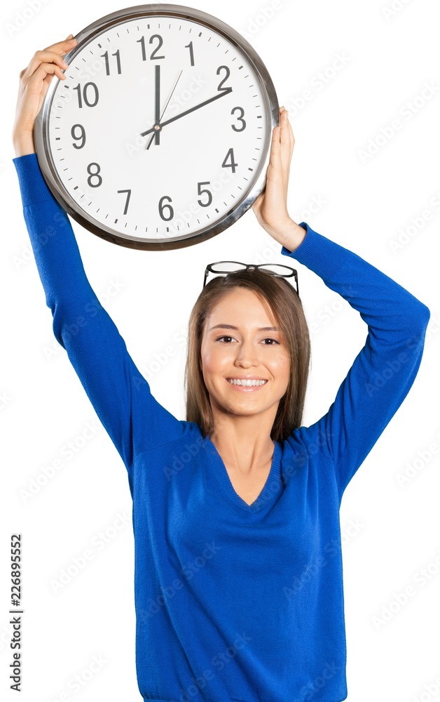 Young Woman Holding Wall Clock Over her Head - Isolated