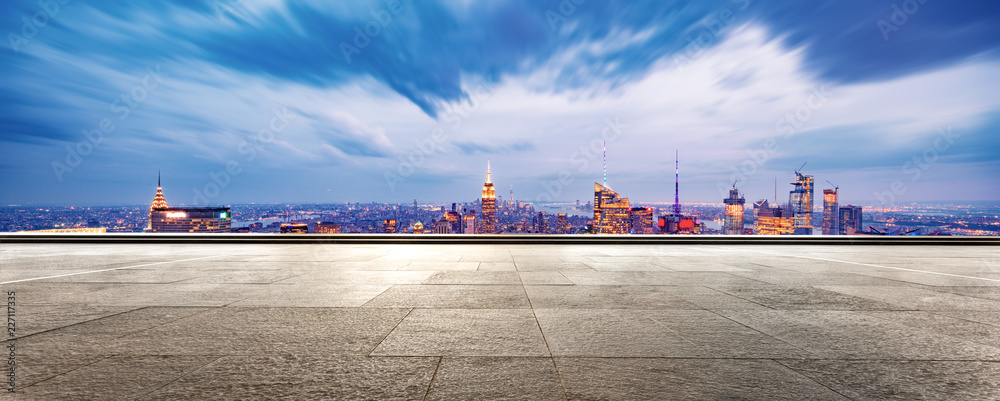 empty ground with modern cityscape new york at night