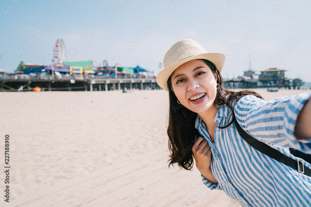 a female traveler taking selfie