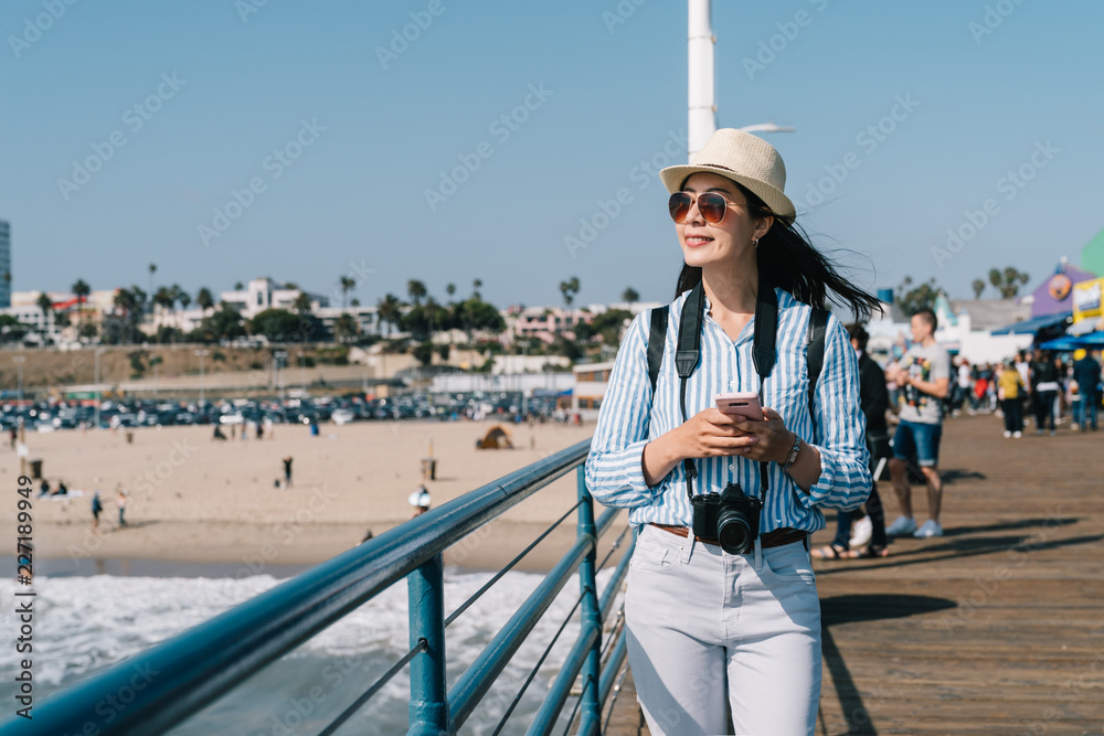 a beautiful traveler walking nearby the beach