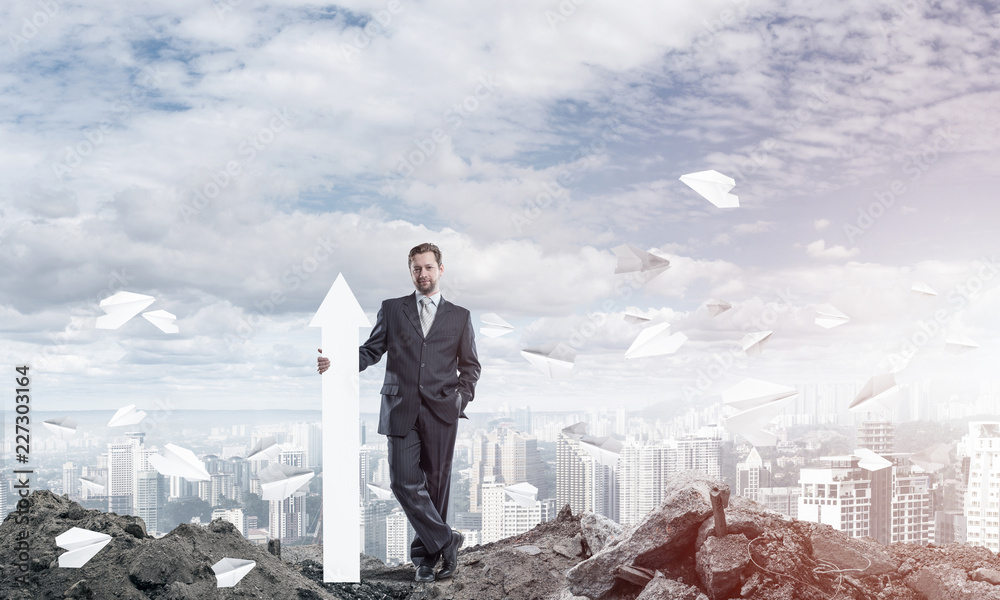 Conceptual image of businessman in ruins