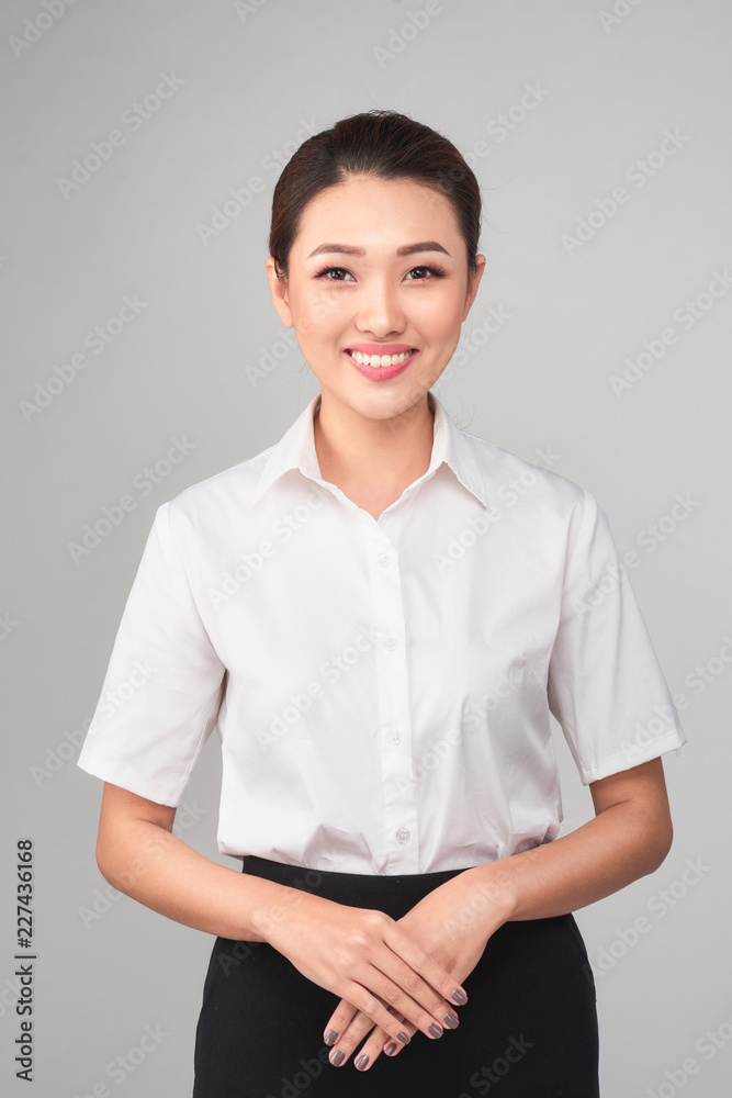 Formal Asian Business woman on gray background