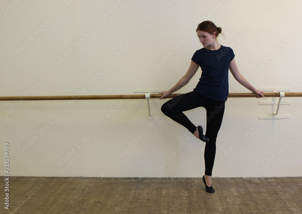 woman doing warm-up in the ballet hall