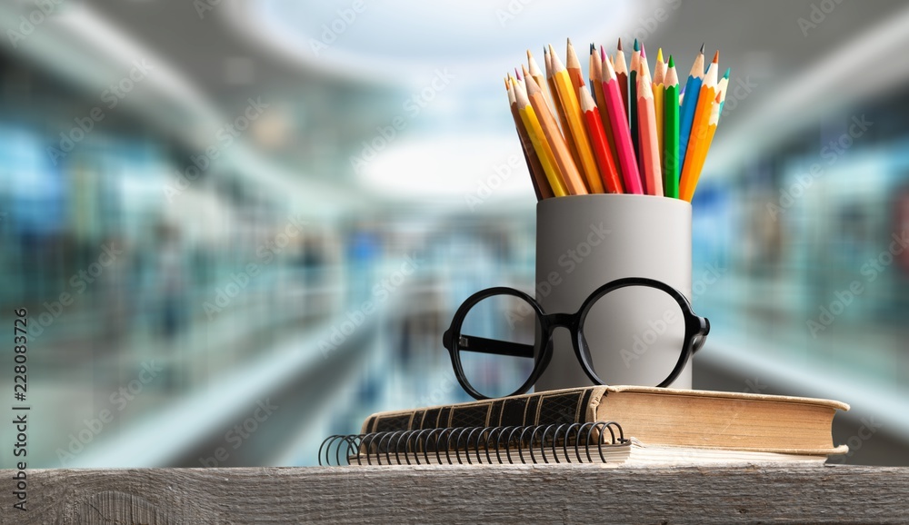 School Backpack with stationery on background