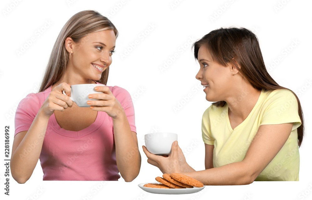 Portrait of Two Girlfriends / Sisters Talking and Drinking