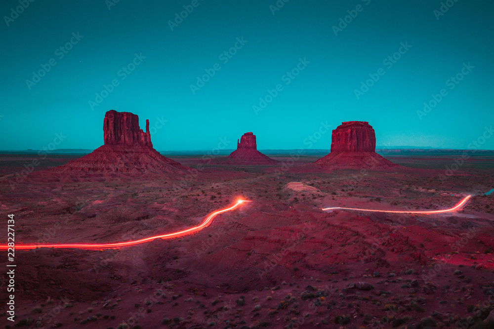 Monument Valley with light trails at night, Arizona, USA