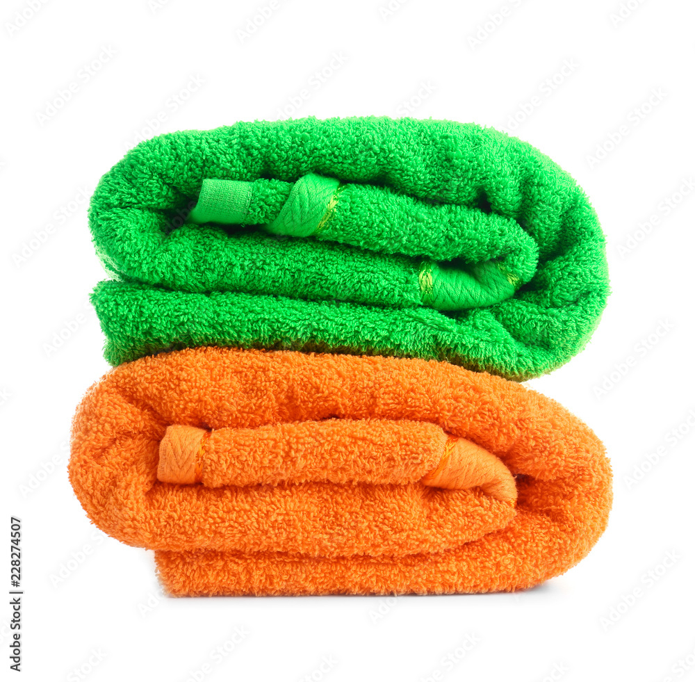 Stack of colorful towels on white background