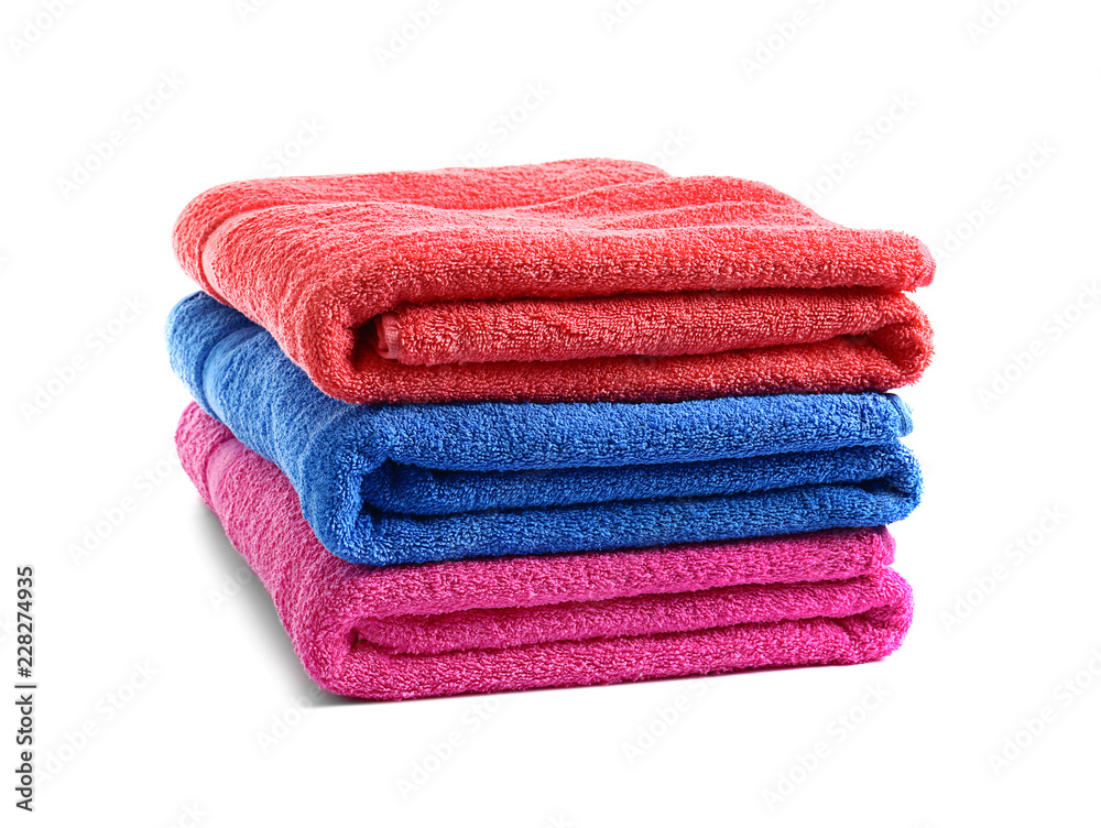 Stack of bright soft towels on white background