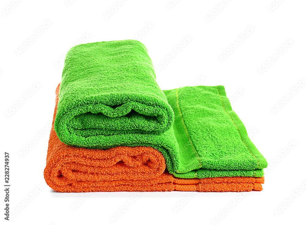 Stack of bright soft towels on white background