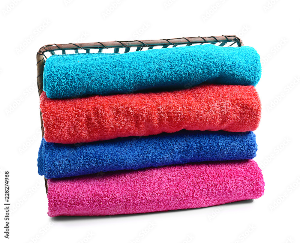 Stack of bright terry towels on white background