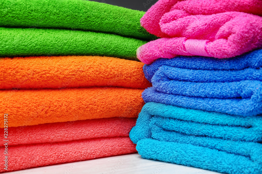 Stack of bright clean towels, closeup